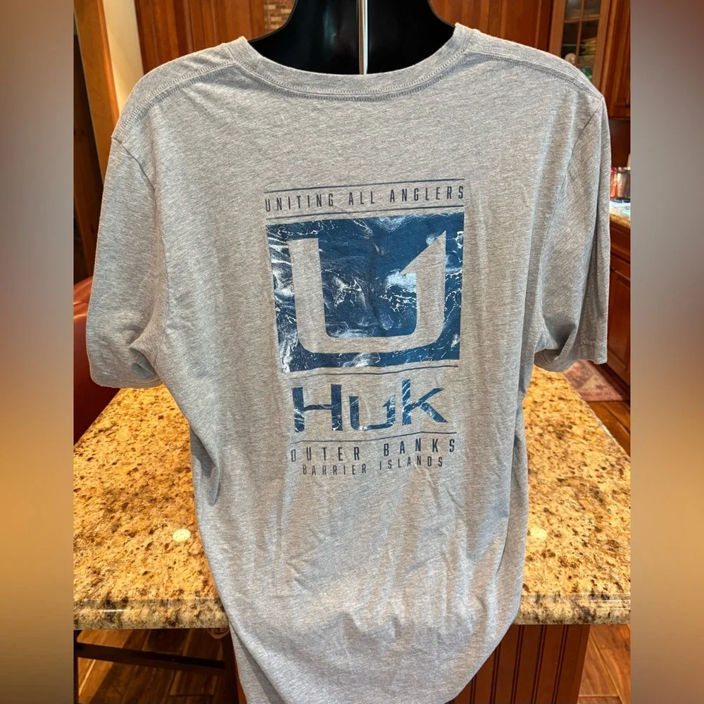 Huk men’s Outer Banks Angler t-shirt. Sharp blue print w/logos front/back/sleeve